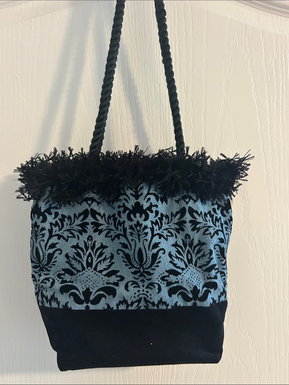 Purse with black velvet base and whimsical ruffle.